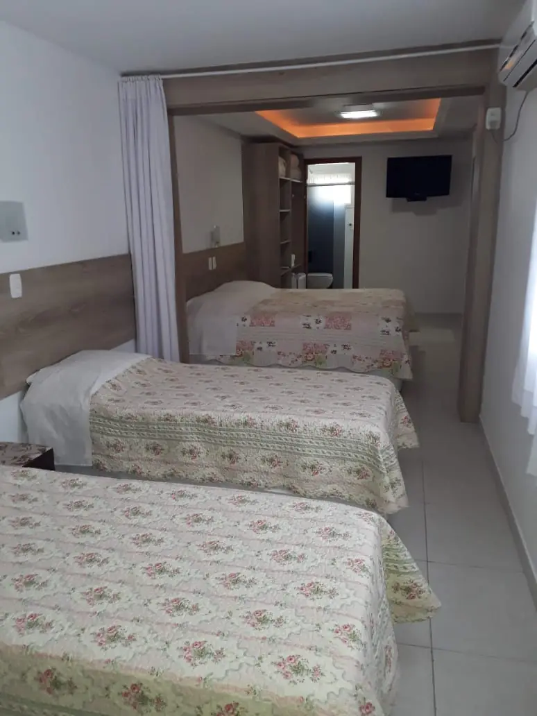Apartamento com camas de solteiro da Pousada Florenza
